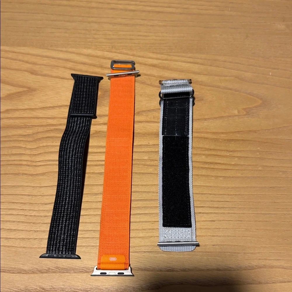 Orange, Black, and Gray Wearable Wristbands